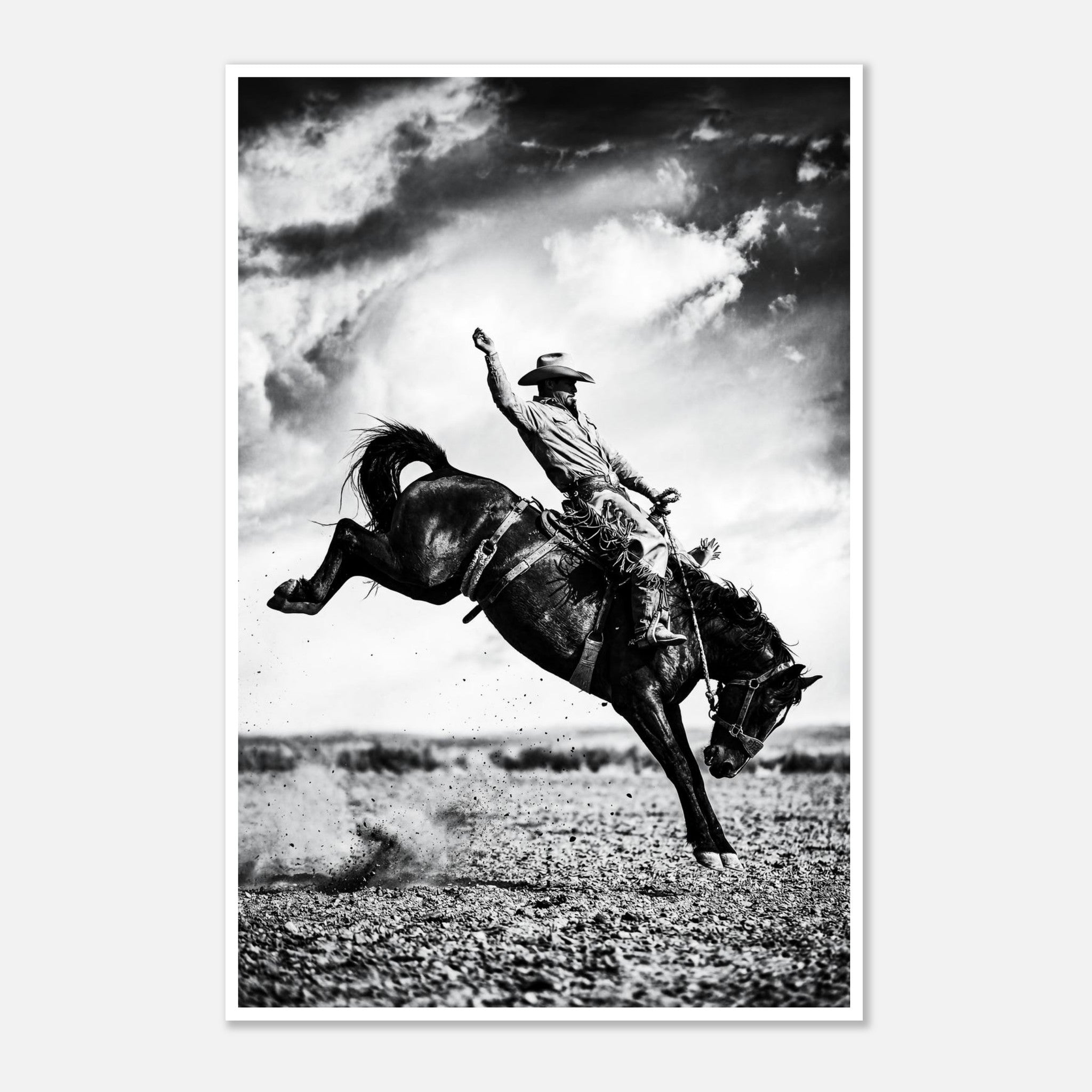 Black and white rodeo wall art showing a cowboy riding a bucking horse in motion.