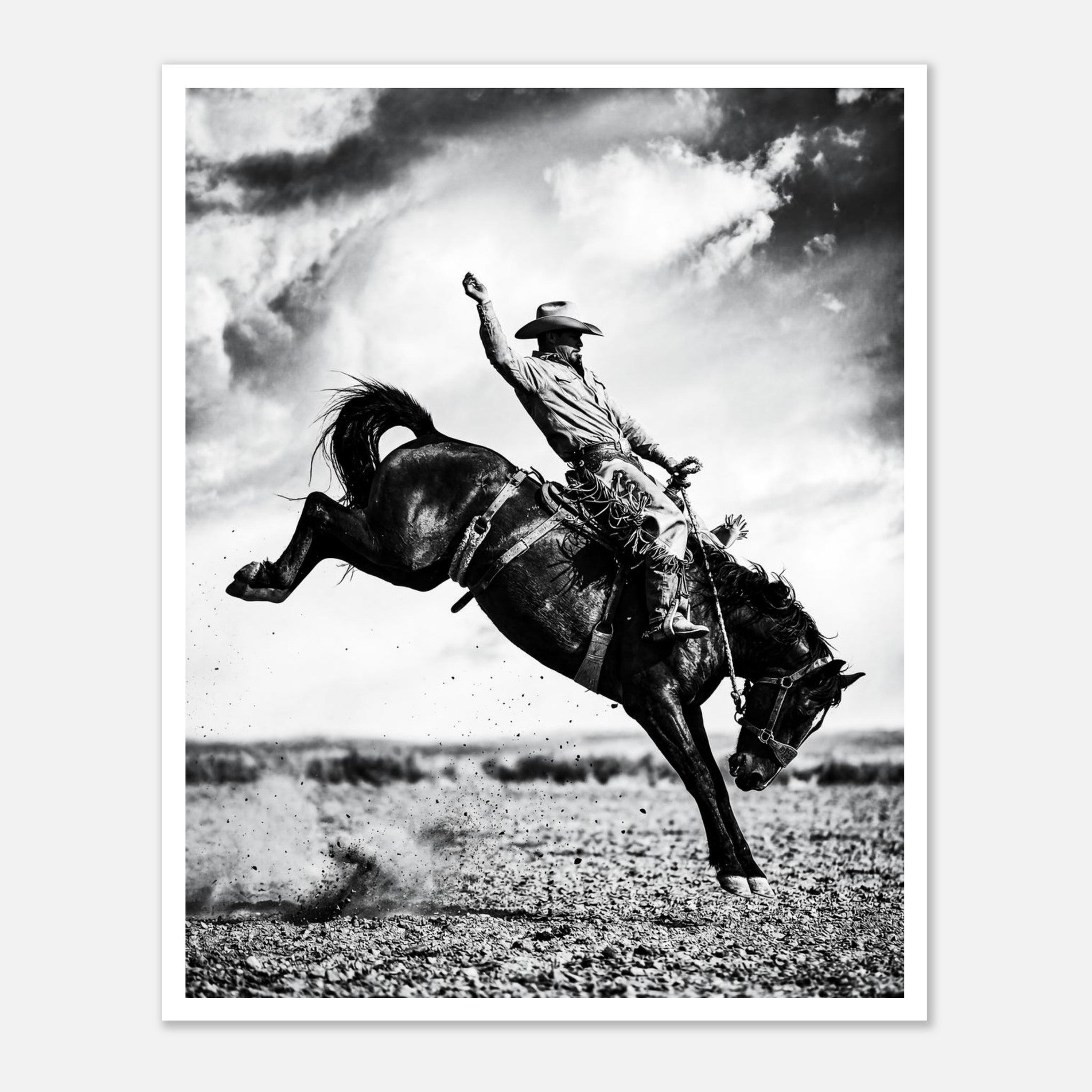 Black and white rodeo wall art showing a cowboy riding a bucking horse in motion.