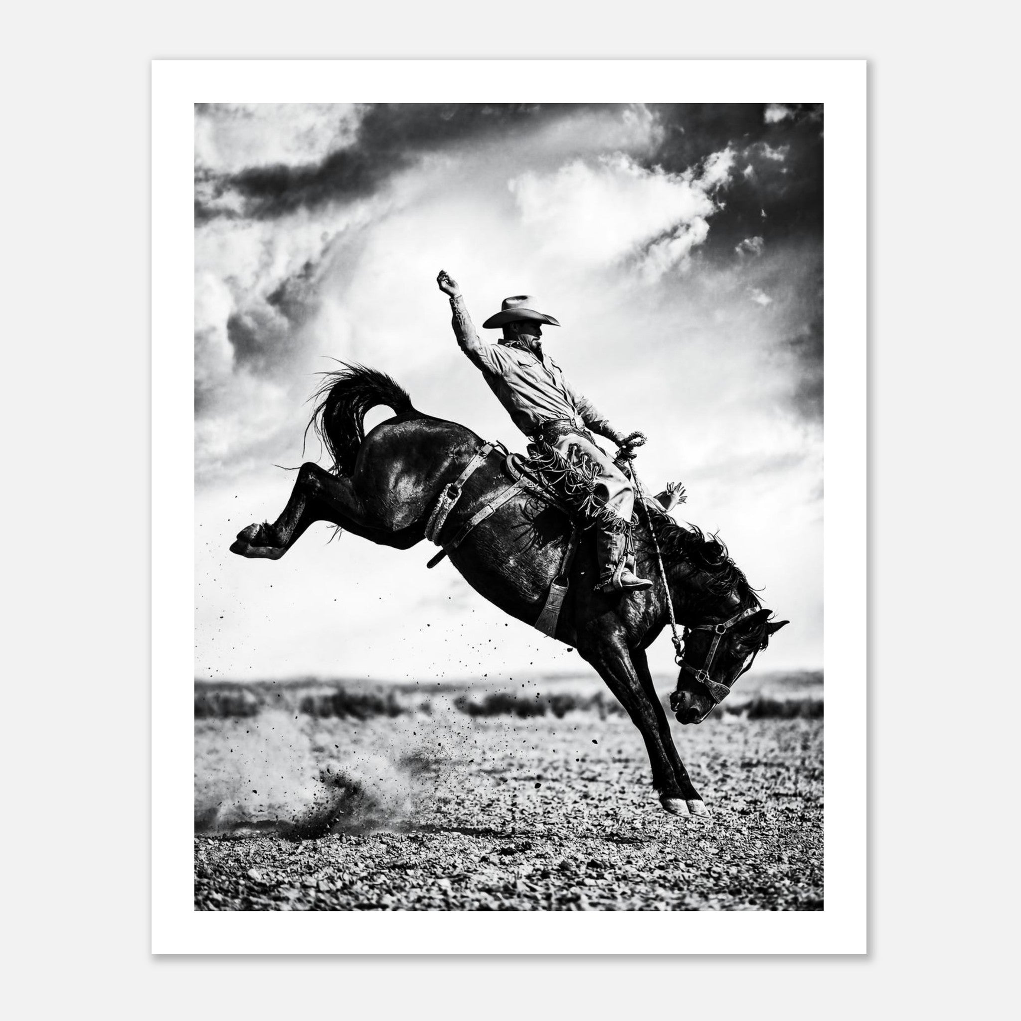 Black and white rodeo wall art showing a cowboy riding a bucking horse in motion.