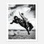 Black and white rodeo wall art showing a cowboy riding a bucking horse in motion.