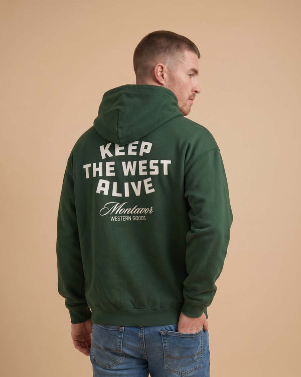 Back view of Montavor Keep The West Alive western hoodie with oversized western graphic print and relaxed fit design on a man.