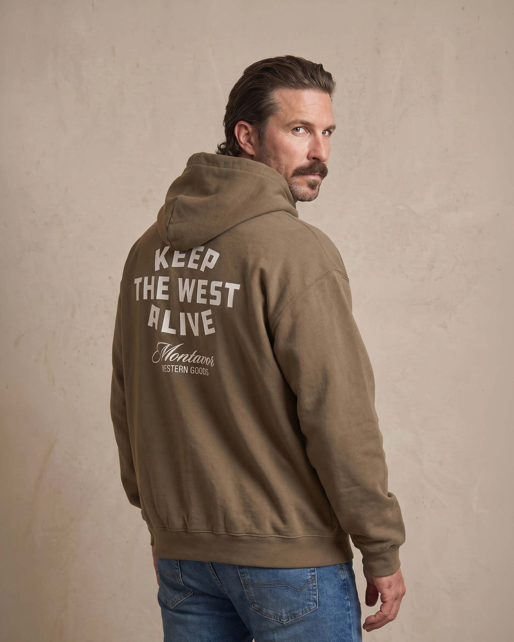Back view of Montavor Keep The West Alive western hoodie with oversized western graphic print and relaxed fit design.