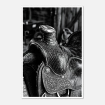 Black and white close up of a western saddle with worn leather and detailed craftsmanship, ranch wall art.