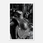 Black and white close up of a western saddle with worn leather and detailed craftsmanship, ranch wall art.