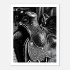 Black and white close up of a western saddle with worn leather and detailed craftsmanship, ranch wall art.