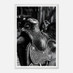 Black and white close up of a western saddle with worn leather and detailed craftsmanship, ranch wall art.