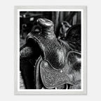 Black and white close up of a western saddle with worn leather and detailed craftsmanship, ranch wall art.