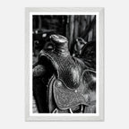 Black and white close up of a western saddle with worn leather and detailed craftsmanship, ranch wall art.
